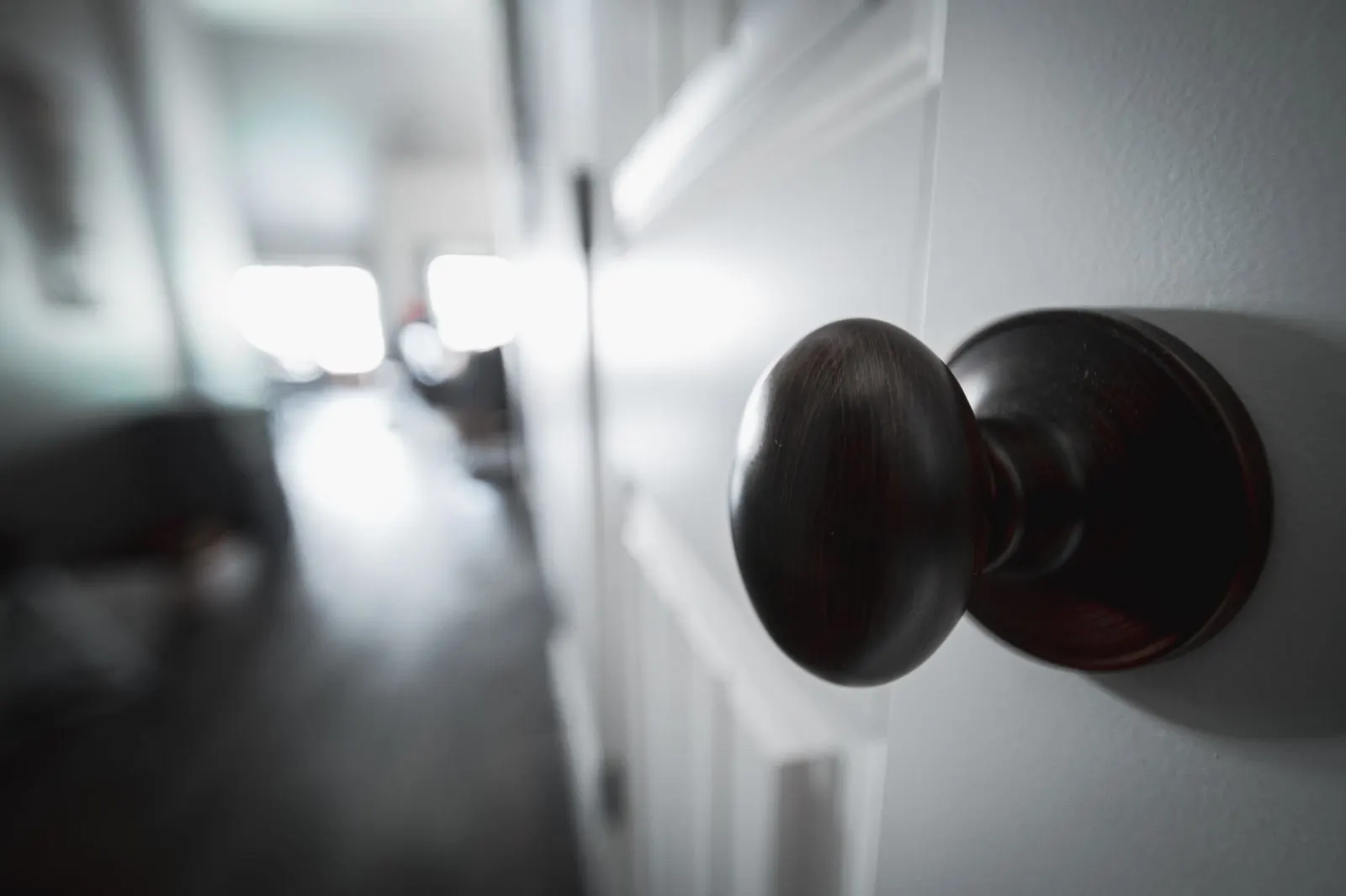 Oil-rubbed bronze door knob on a white interior door
